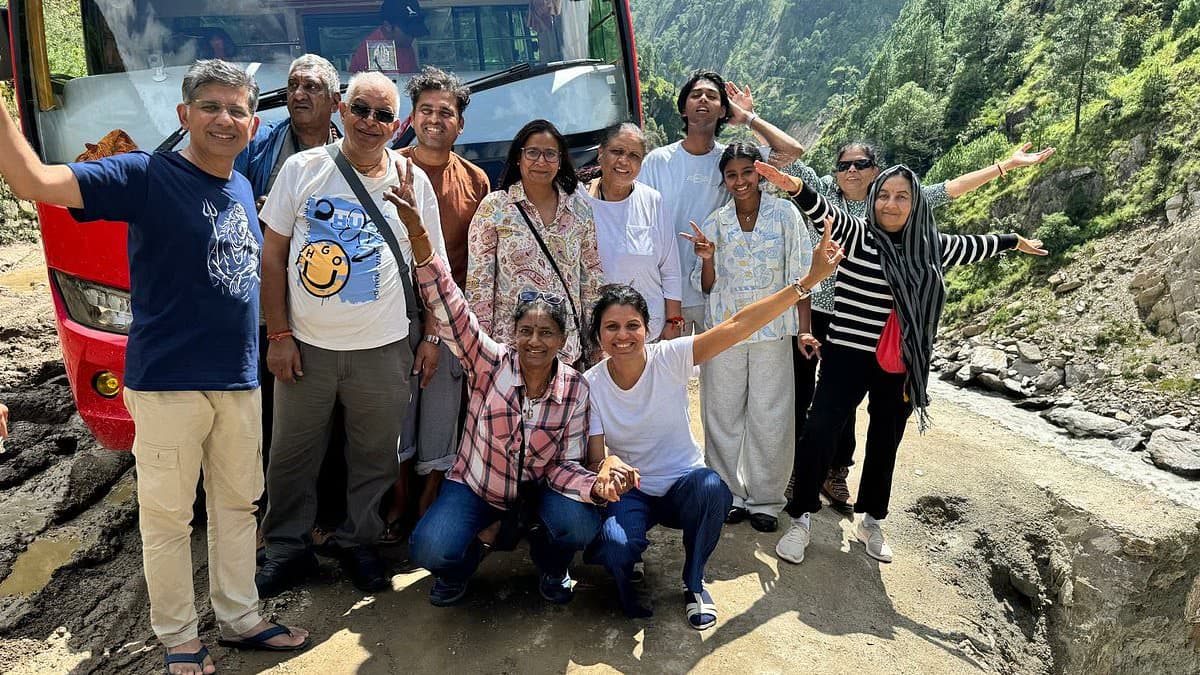 Smiles before the disaster: Millionaire family from Surrey including a former Mrs India UK pose with Nepal tour group before flash flood hit... as hunt for 33 missing British tourists continues